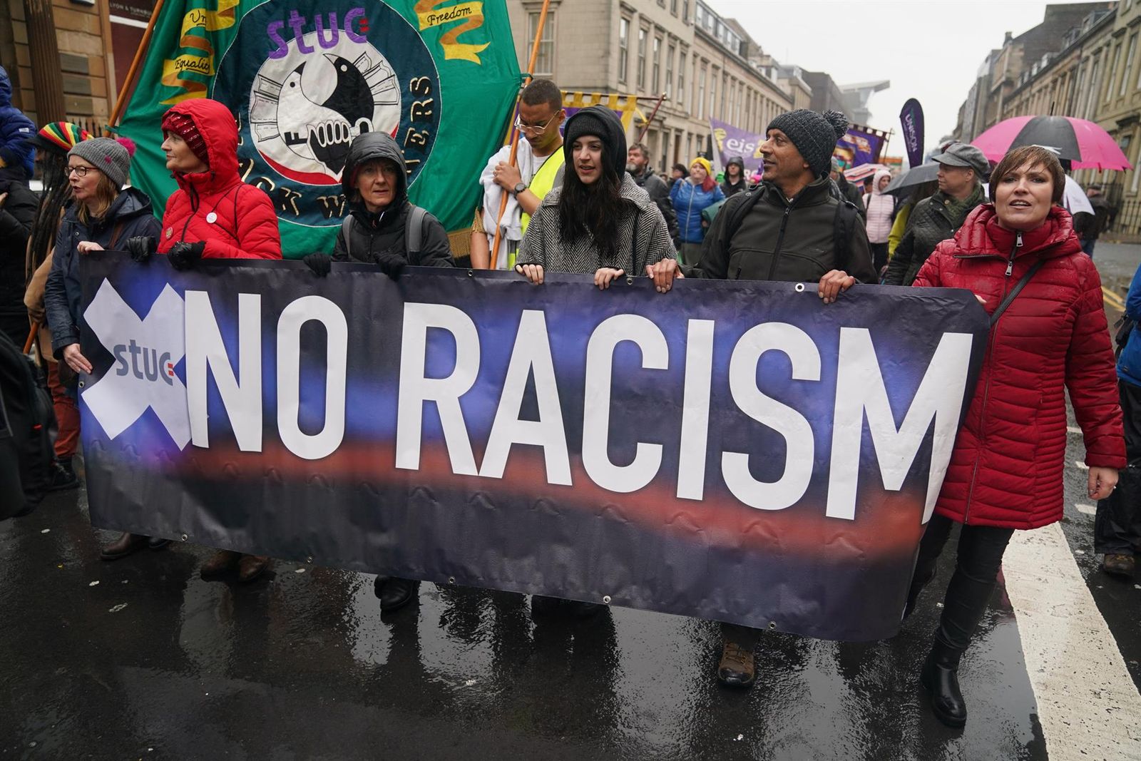 26 November 2022, United Kingdom, Glasgow: People take part in an anti-racism and anti-fascist march in Glasgow, organised by the Scottish Trade Unions Congress (STUC), as part of the annual St Andrew's Day march and rally. - Andrew Milligan/PA Wire/dpa