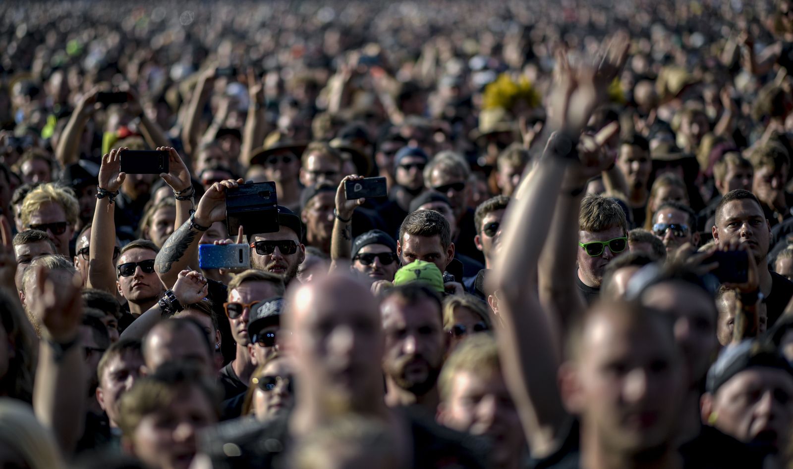 03 August 2019, Schleswig-Holstein, Wacken: Revellers take part in the last day of the 2019 Wacken Open Air music festival. Photo: Axel Heimken/dpa